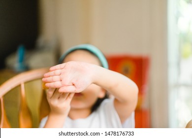 Portrait Of Little Asian Girl Child Hand Cover And Close Her Mouth And Face With No Appetite In Front Of The Meal.Concept Of Loss Of Appetite.