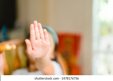 Portrait Of Little Asian Girl Child Hand Cover And Close Her Mouth And Face With No Appetite In Front Of The Meal.Concept Of Loss Of Appetite.