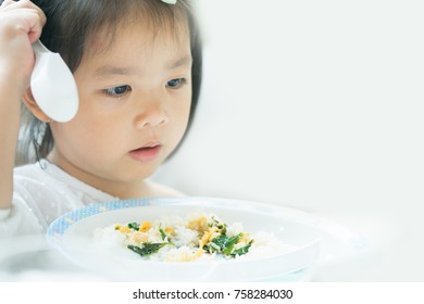 Portrait Of Little Asian Girl Child With No Appetite In Front Of The Meal.Concept Of Loss Of Appetite