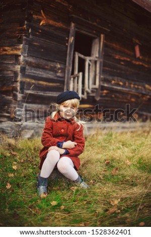 Similar – Foto Bild fröhlich lustiges Kind Mädchen isst frischen Apfel im Herbst