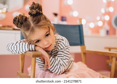 Portrait Of A Little Beautiful Girl With A Stylish Hairstyle In A Beauty Salon