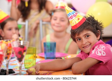 Portrait Of A Little Boy At A Birthday Party