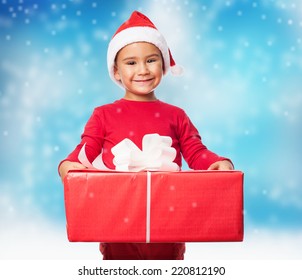 Portrait Of A Little Boy Holding A Big Gift