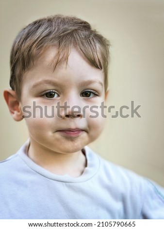 Similar – Image, Stock Photo Little cute boy looking at camera and sticking out his tongue