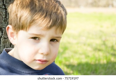 Portrait of the little boy on green background - Shutterstock ID 75719197