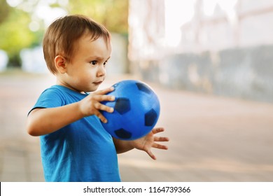 toddler throwing ball