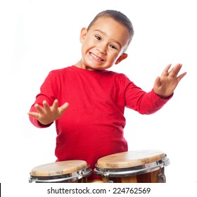 portrait of a little boy playing bongos - Powered by Shutterstock