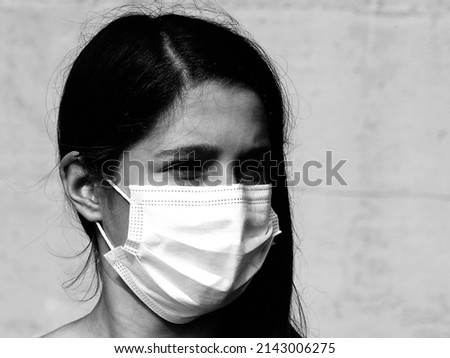 portrait of little boy with surgical mask with black and white effect