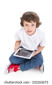 Portrait of a little boy with tablet, isolated on white background.