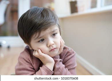 Portrait Of Little Boy With Upset Face, Kid Sad Face Sitting Alone In The Room, Unhappy Child Looking Out, Spoiled Children Concept