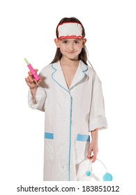 Portrait of little caucasian girl in medical costume holding syringe isolated on white