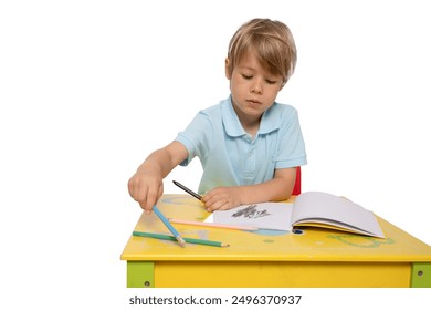 Portrait of a little child drawing, a child sitting at a table with art supplies, drawing on paper. - Powered by Shutterstock