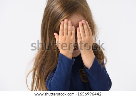 
portrait of a little emotional girl who is surprised, smiling, on a white background