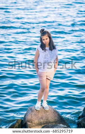 Similar – On the road in Venice. A girl stands on a bridge.