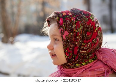 Portrait Of  Little Girl 3 Years Old In  Pink Russian Folk Scarf  In Winter