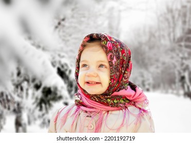 Portrait Of  Little Girl 3 Years Old In  Pink Russian Folk Scarf  In Winter