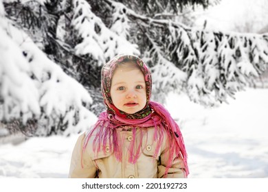 Portrait Of  Little Girl 3 Years Old In  Pink Russian Folk Scarf  In Winter