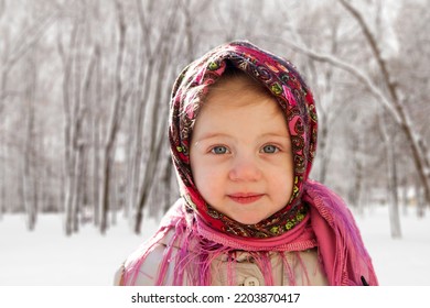 Portrait Of  Little Girl 3 Years Old In  Pink Russian Folk Scarf  In Winter