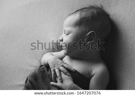 Similar – Newborn sleeping lying on blanket