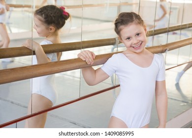 portrait of a little girl ballerina practicing in classical ballet school - Shutterstock ID 1409085995