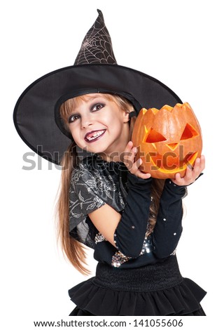 Portrait of little girl in black hat with pumpkin isolated on white background