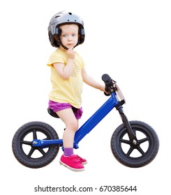 Portrait Of A Little Girl Boy Toddler Riding A Balance Bike Bicycle In Helmet On The Road, Seasonal Child Activity Concept, Healthy Childhood Lifestyle, Isolated On White Background