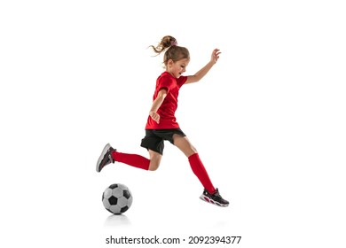 Portrait Of Little Girl, Child, Training, Playing Football Isolated Over White Background. Dribbling Exercises. Concept Of Action, Sportive Lifestyle.