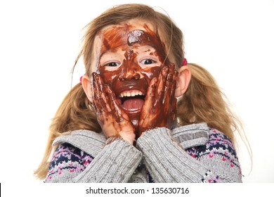 Portrait Of A Little Girl With Chocolate Covered Face