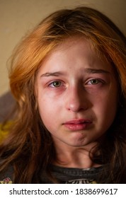 Portrait of little girl crying with tears rolling down her cheeks. Girl crying. Girl 9 years old is very upset. Teenage problems. 9 or 10 years old girl in transition. Sadness.