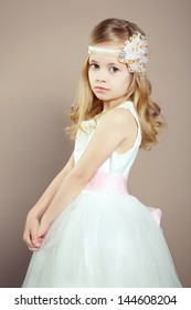 Portrait Of Little Girl In Luxurious Dress. Fashion Photo