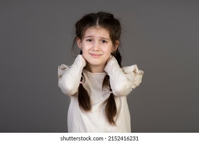 Portrait Of Little Girl Massaging Painful Back, Feel Discomfort In Neck, Child Sedentary Lifestyle.