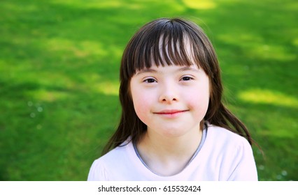 Portrait of little girl smiling outside