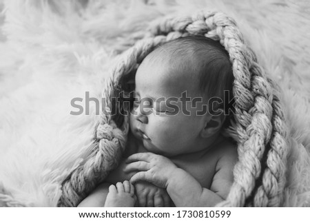 Similar – Newborn baby awake on a blanket