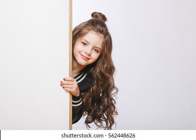 Portrait Of Little Hipster Girl Looking Out. Curly Hairstyle. Copy-space