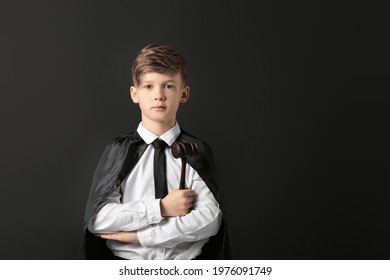 Portrait Of Little Judge On Dark Background