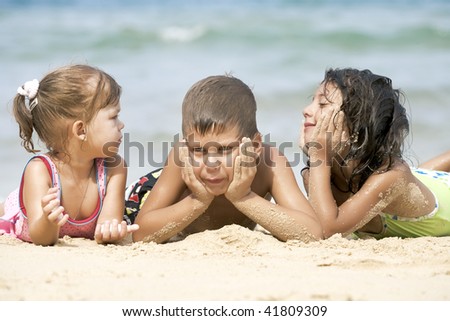 Similar – Two kids digging on the beach