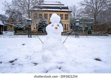 Portrait Of A Little Snowman On A Hazy Day In A Public Park 