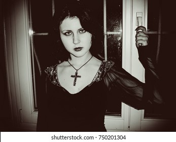 Portrait Of Lonely And Sad Goth Girl In Room. Passion For Occultism And Black Magic Among Adolescents. Negative Influence Of Subcultures On Mentality Of Teenagers