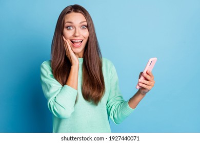 Portrait of lovely amazed cheerful brown-haired girl using device 5g app post like reaction isolated on bright blue color background