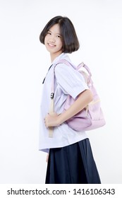 Portrait Of Lovely Asian Girl In School Uniform With School Bag On White Background Isolated