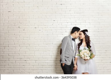 https://image.shutterstock.com/image-photo/portrait-lovely-asian-newlywed-couple-260nw-364395038.jpg