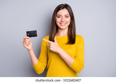 Portrait of lovely glad cheerful girl holding in hands demonstrating bank card solution isolated over grey color background - Shutterstock ID 1922682407