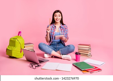 Portrait lovely lady teen teenager sit have thought thoughtful imagine guess computer laptop use user question isolated checked shirt trendy stylish jeans denim pink background