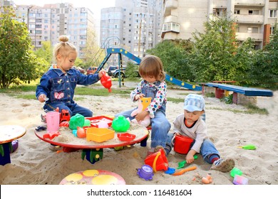 Portrait of the lovely little kids playing at the playground