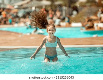 Portrait of lovely little teenage girl ressting on the edge of swimming pool and squinting her eyes because of the bright sun - Shutterstock ID 2315236043