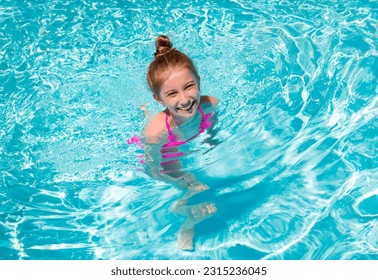 Portrait of lovely little teenage girl ressting on the edge of swimming pool and squinting her eyes because of the bright sun - Shutterstock ID 2315236045