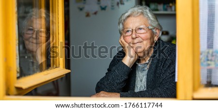 Similar – Image, Stock Photo Elderly woman in yellow top with a warm smile