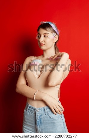 Similar – Image, Stock Photo Young and blonde woman holding a strawberry ice cream