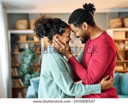 Portrait of a lovely young couple together, bonding hugging and relaxing at home