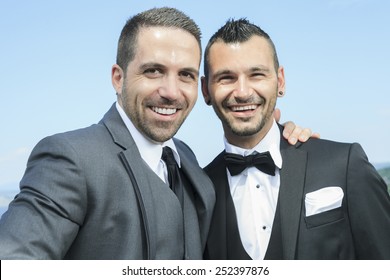 Portrait Of A Loving Gay Male Couple On Their Wedding Day.